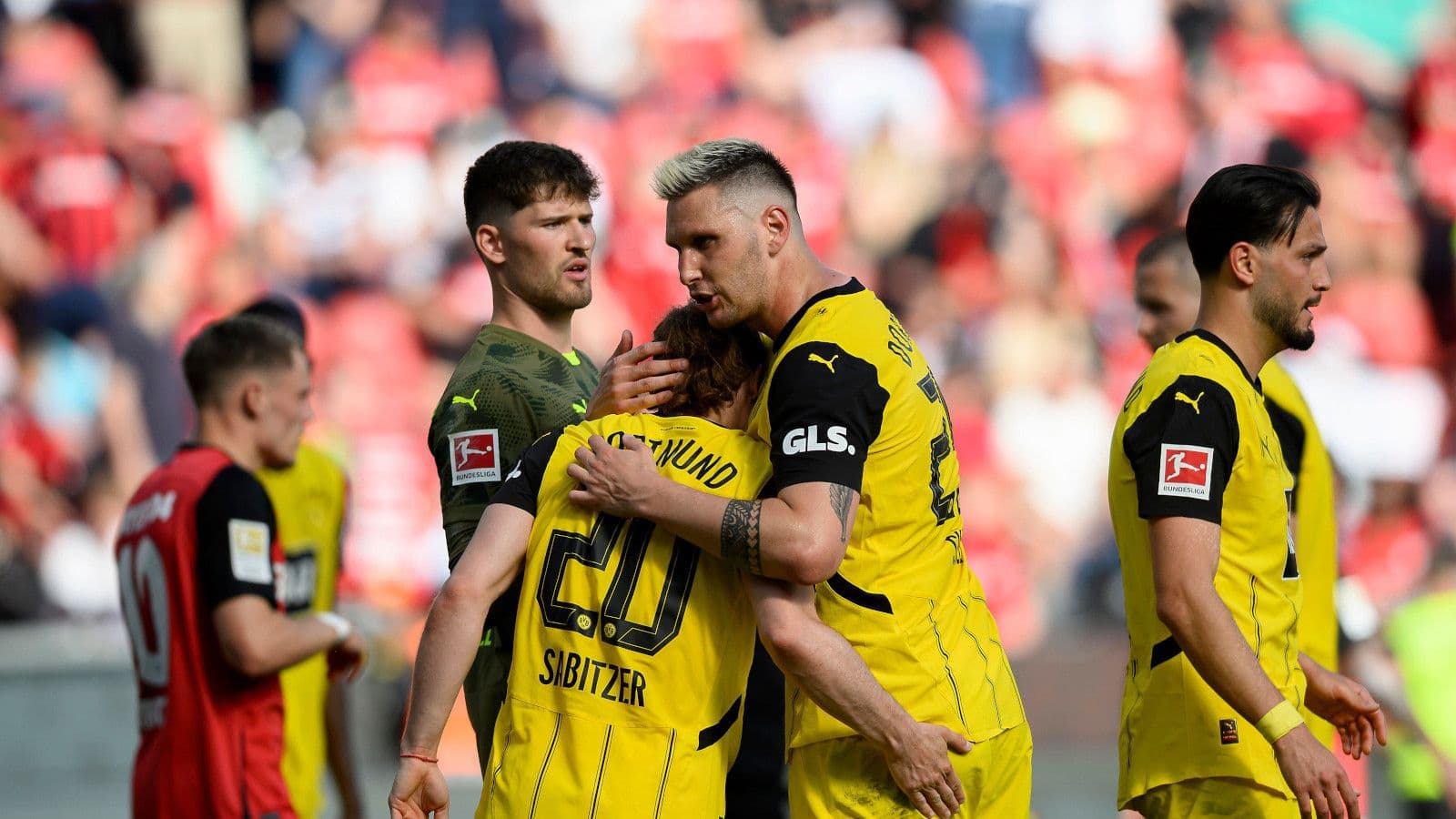 Dortmund fight back to sink Leverkusen and keep Champions League hopes alive