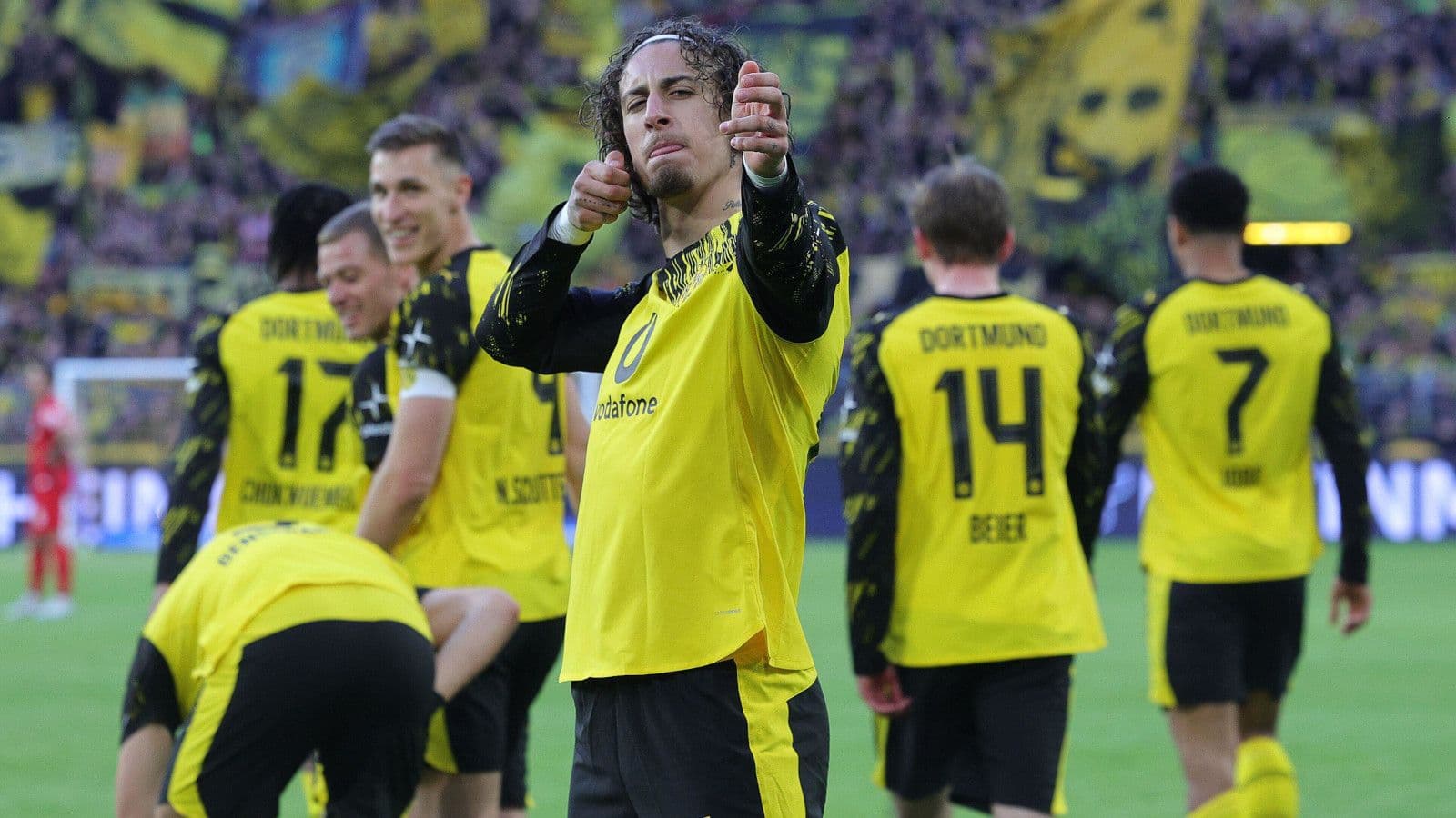 Dortmund thrash Freiburg in 1,000th home game to seal Champions League spot