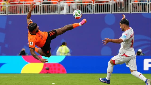 fifa-world-cup-group-f-dutch-cruise-past-tunisia-japan-and-sweden-book-place-in-knockouts-1