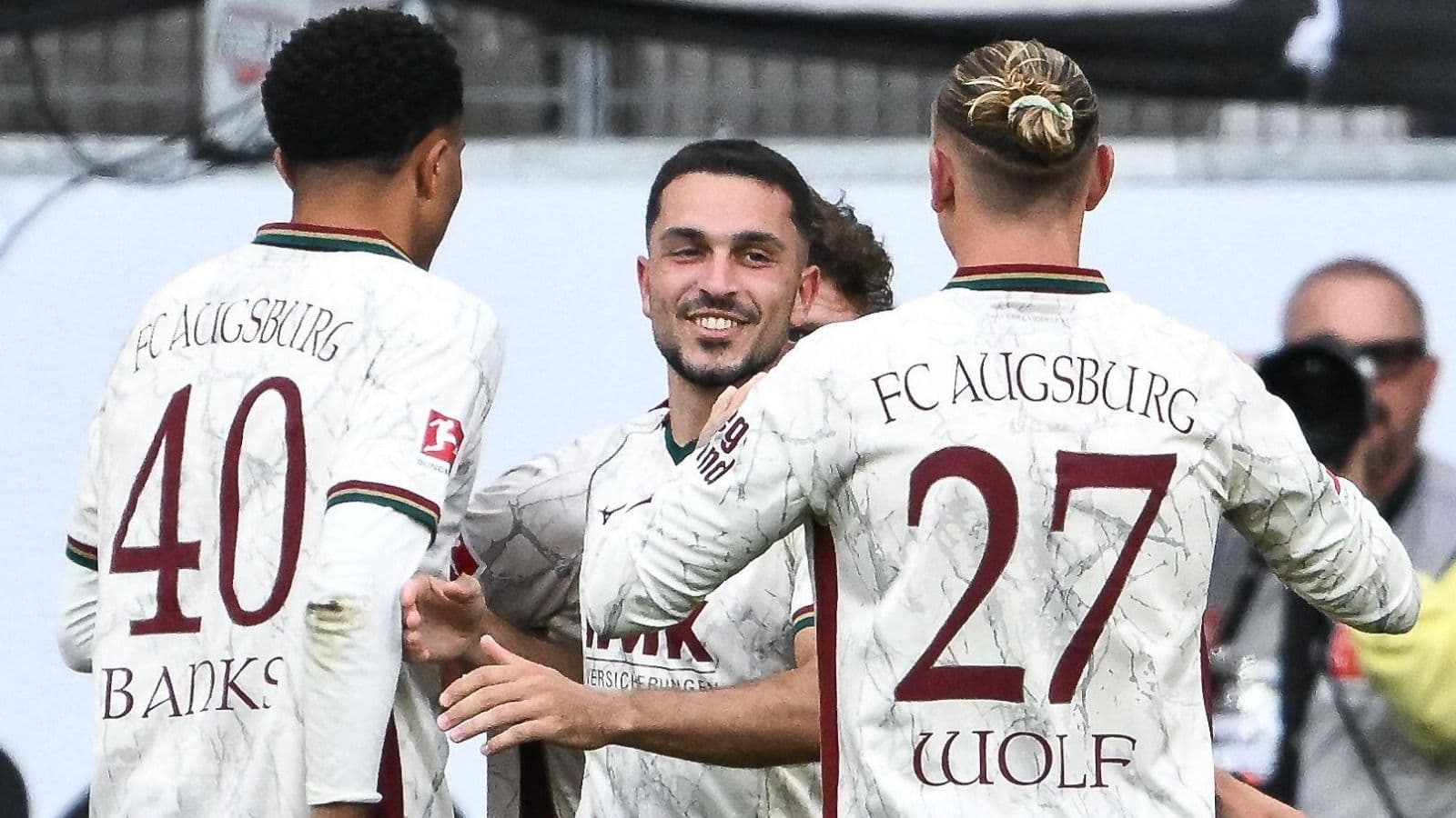 Augsburg storm back against Frankfurt to go top of Bundesliga